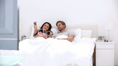 Couple watching television together
