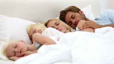 Parents and children sleeping together