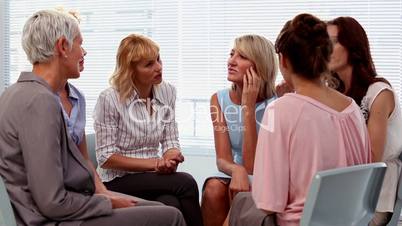 Buisnesswomen chatting in a circle