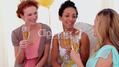 Friends toasting with champagne at a party