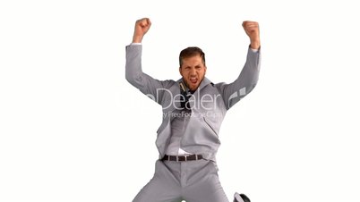 Excited businessman jumping on white background