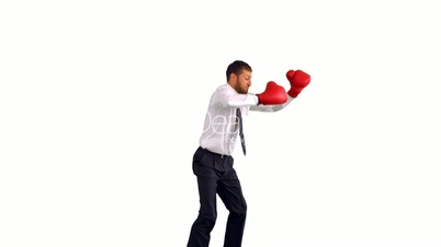 Businessman in boxing gloves jumping and punching