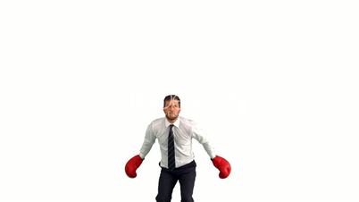 Businessman in boxing gloves jumping and punching his fists together