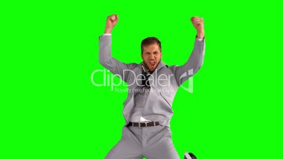 Businessman jumping and cheering
