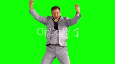 Businessman cheering and jumping