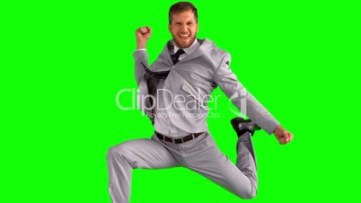Happy businessman cheering and jumping