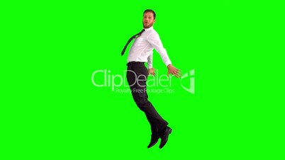 Businessman jumping and stretching his body