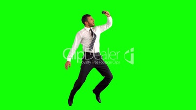 Businessman taking self portrait while jumping