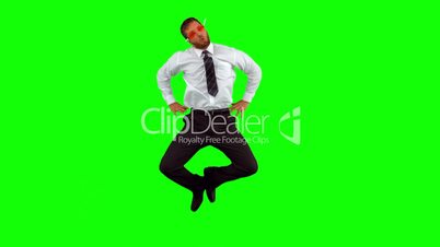 Businessman wearing swimming goggles jumping