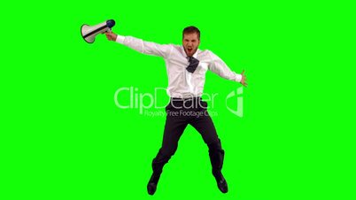 Businessman holding megaphone jumping up and shouting