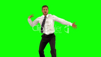 Businessman walking towards camera and dancing funnily