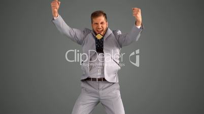 Succesful businessman leaping on grey background