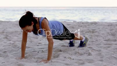 Woman exercising on the beach