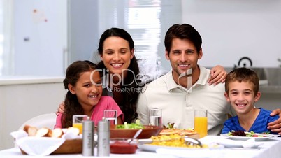 Family smiling and waving