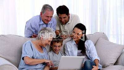 Extended family using laptop together