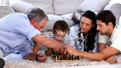 Extended family playing chess