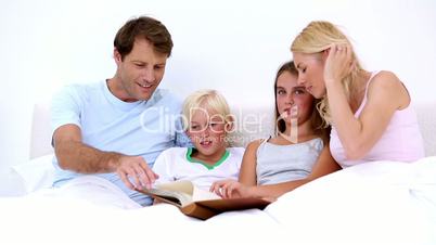 Cute family reading together