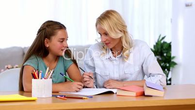 Mother and daughter doing homework together