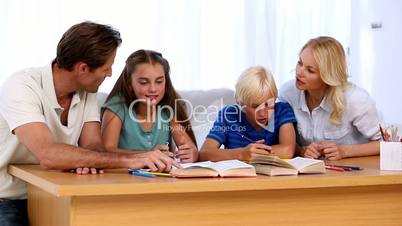 Parents doing homework with their children