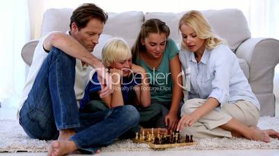Children and parents playing chess