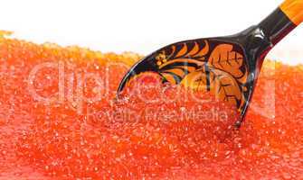 Red salted caviar with wooden spoon