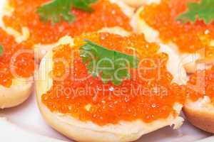 Sandwiches with red salted caviar
