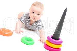 Beautiful baby playing with toys