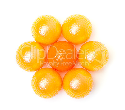 Orange and golden golf balls