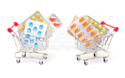 Multicolored pills packs in shopping cart