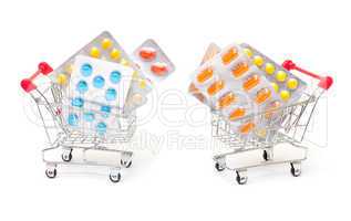 Multicolored pills packs in shopping cart