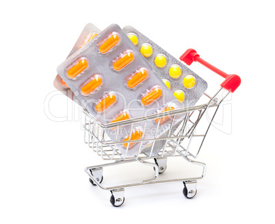 Multicolored pills packs in shopping cart
