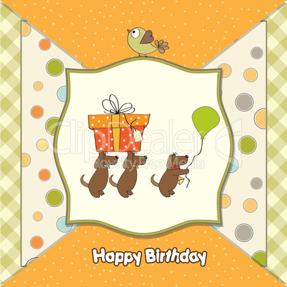 three dogs that offer a big gift. birthday greeting card