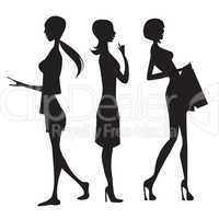 silhouette of three cute fashion girls isolated on white backgro