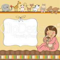 new baby girl announcement card with girl and her toy