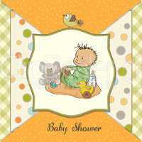 little baby boy play with his toys. shower card in vector format