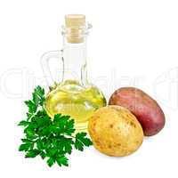 potatoes red and yellow  with a bottle of oil