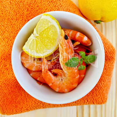 shrimp in a white bowl on orange napkin