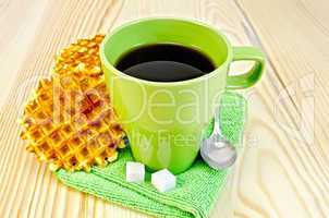 wafers are round with a green mug and sugar