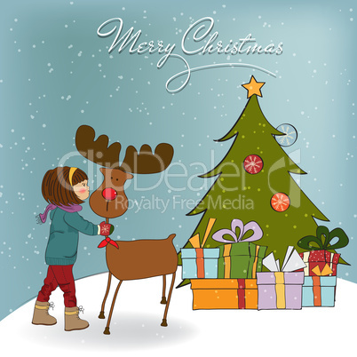 Christmas card with cute little girl caress a reindeer