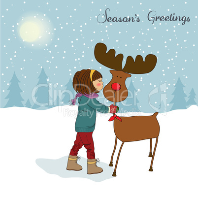 Christmas card with cute little girl caress a reindeer