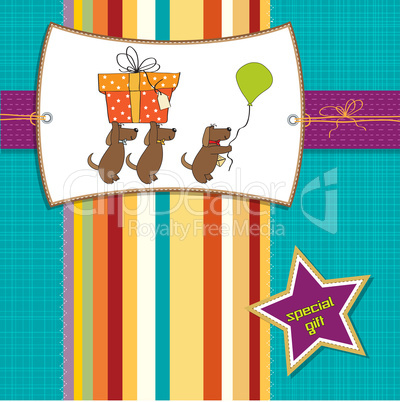 three dogs that offer a big gift. birthday greeting card