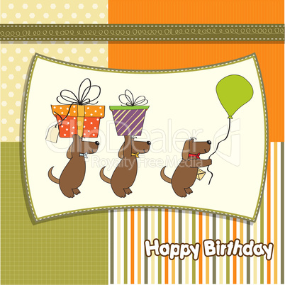 three dogs that offer a big gift. birthday greeting card