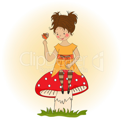 pretty young girl sitting on a mushroom