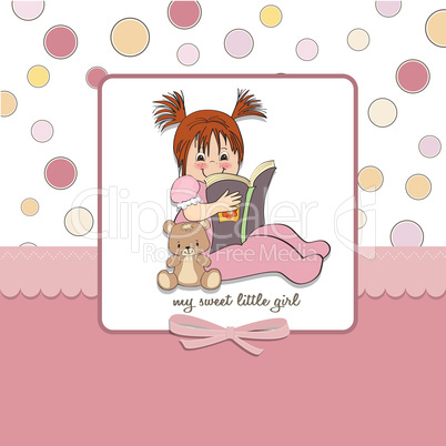 sweet little girl reading a book