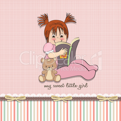 sweet little girl reading a book