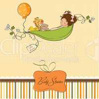 little girl siting in a pea been. baby announcement card