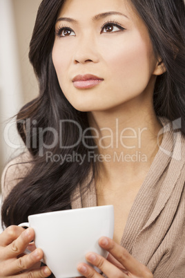 Beautiful Chinese Oriental Asian Woman Drinking Tea or Coffee