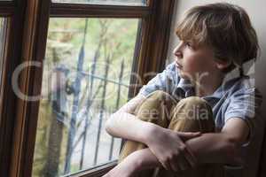 Sad Young Boy Child Looking Out Window