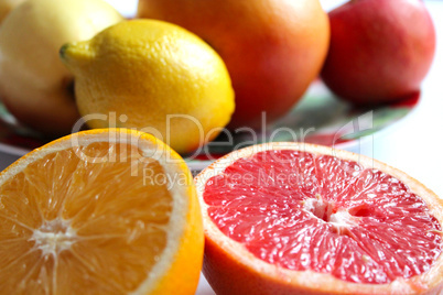 orange grapefruit and lemon divided in half