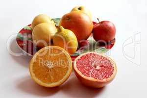 orange grapefruit and lemon divided in half